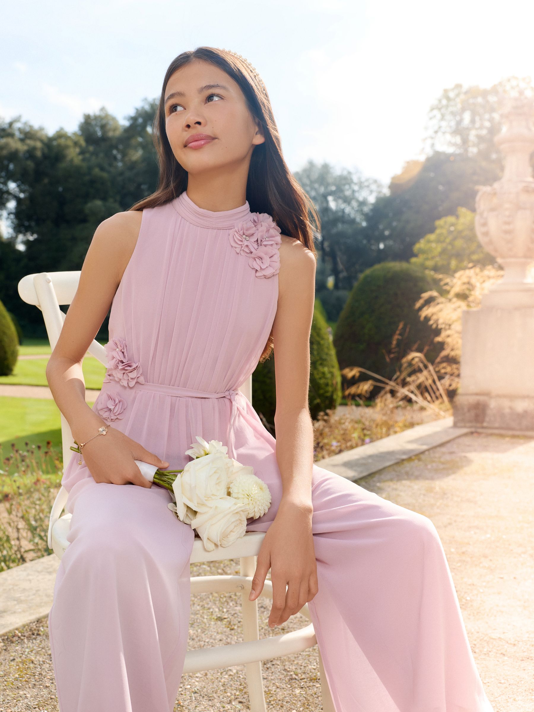 Buy Lipsy Rose Pink Pleated 3D Corsage Occasion Jumpsuit (5-16yrs