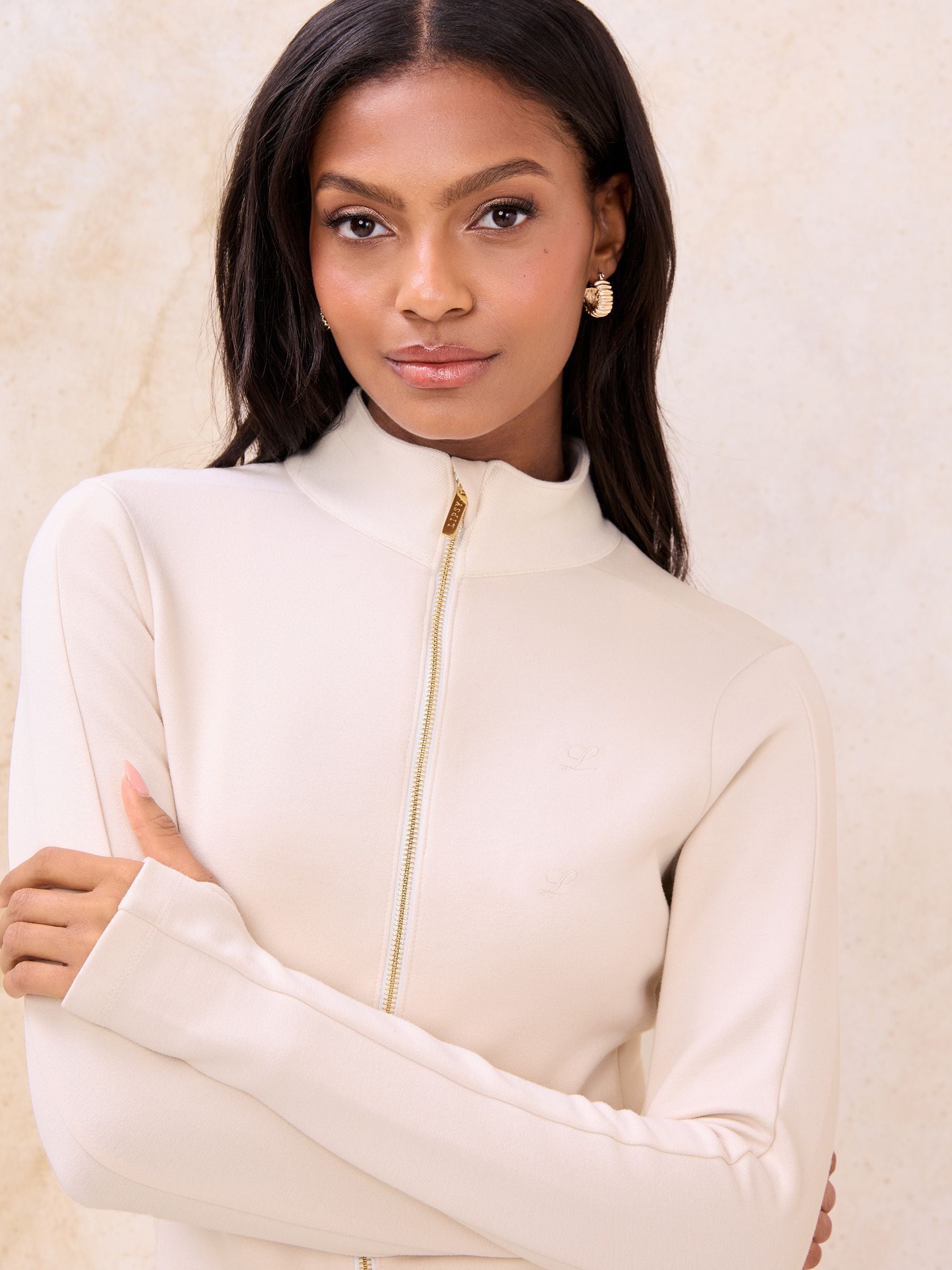 Buy Lipsy Cream Zipped Fitted Scuba Long Sleeve Top from the Next