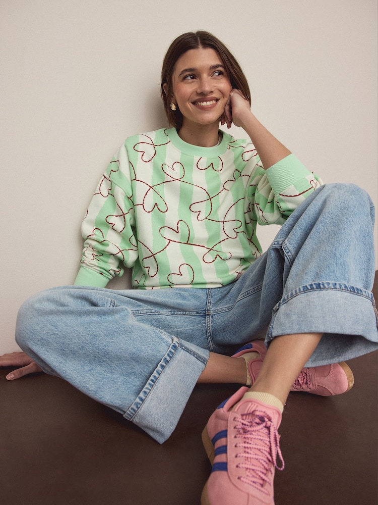 Green Heart Stripe Supersoft Peached Essentials Crew Neck Seam Detail Sweatshirt - Image 1 of 9 Green Heart Stripe Supersoft Peached Essentials Crew Neck Seam Detail Sweatshirt - Image 1 of 9