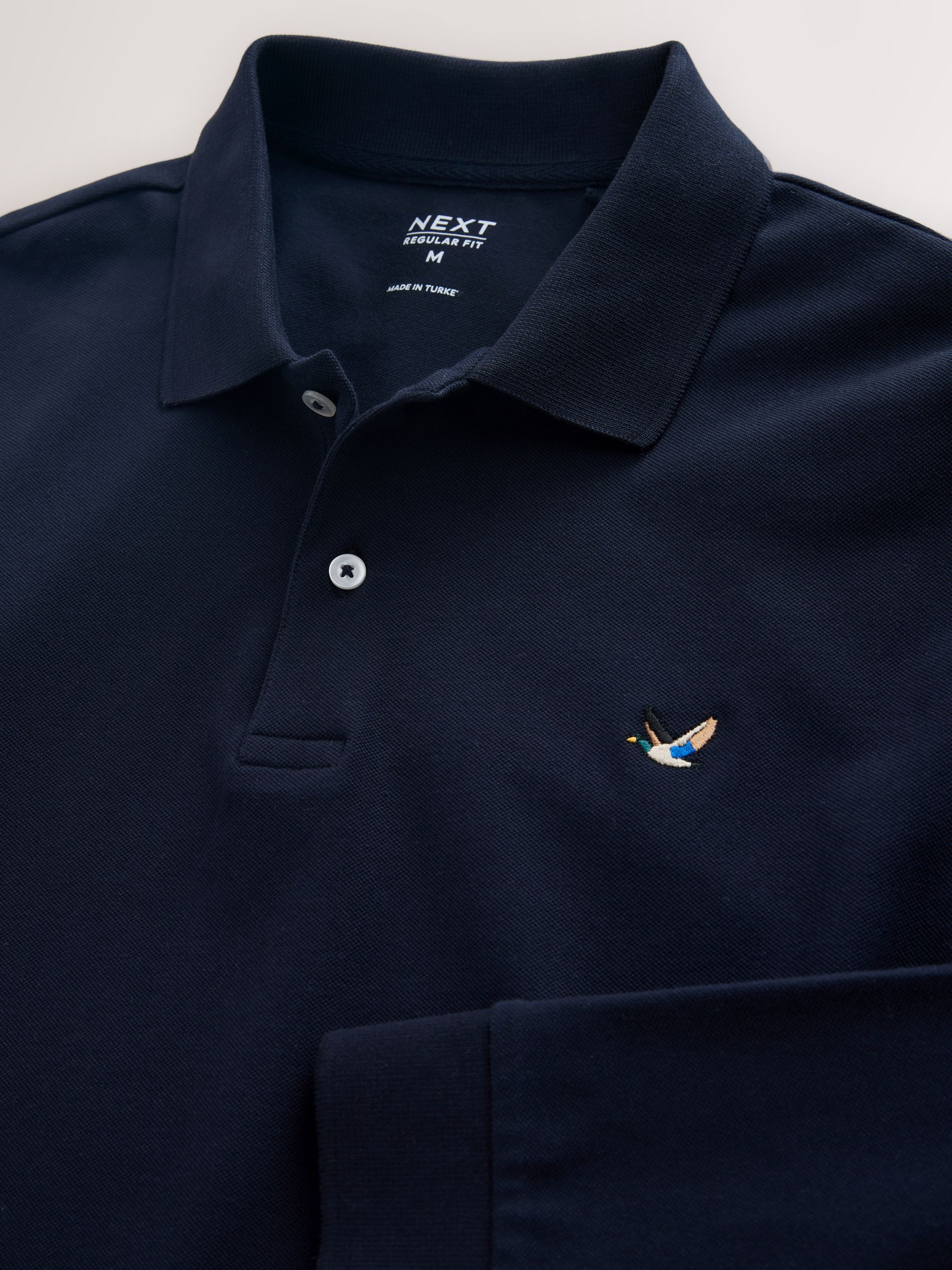 Buy Navy Duck Long Sleeve Pique Polo Shirt from the Next UK online Buy Navy Duck Long Sleeve Pique Polo Shirt from the Next UK online