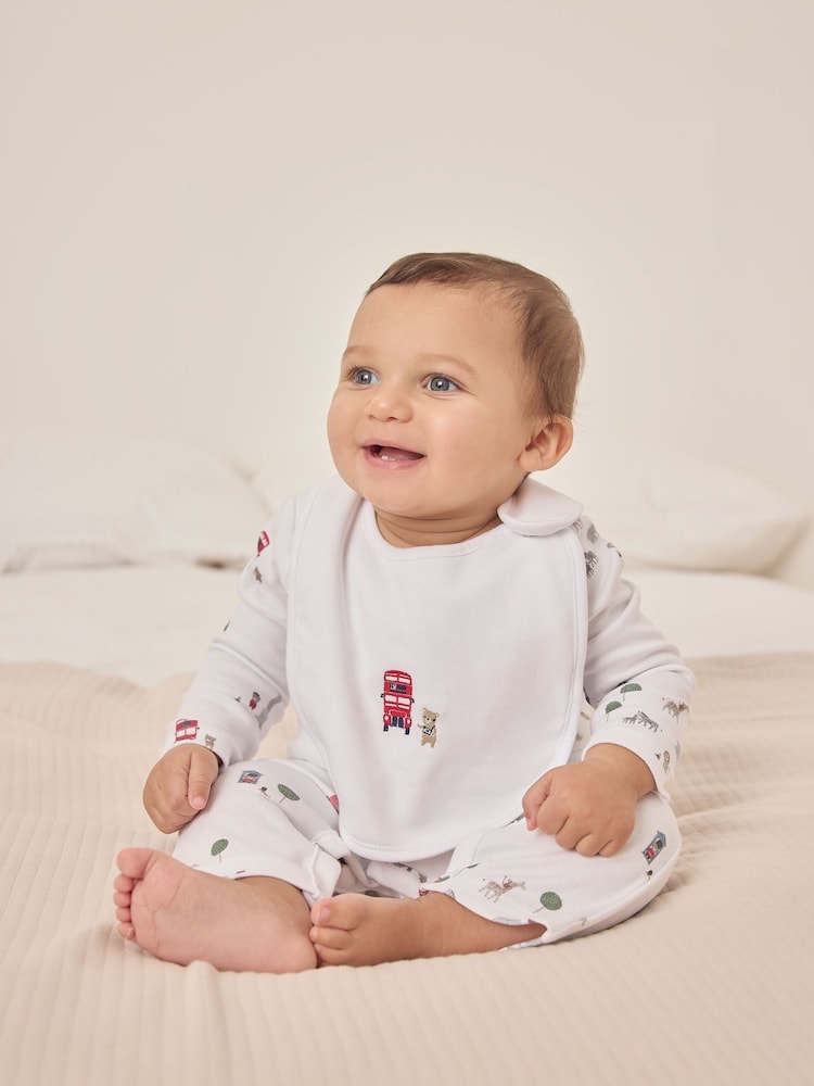 The White Company Sightseeing London White Sleepsuit & Bib Set - Image 1 of 5 The White Company Sightseeing London White Sleepsuit & Bib Set - Image 1 of 5