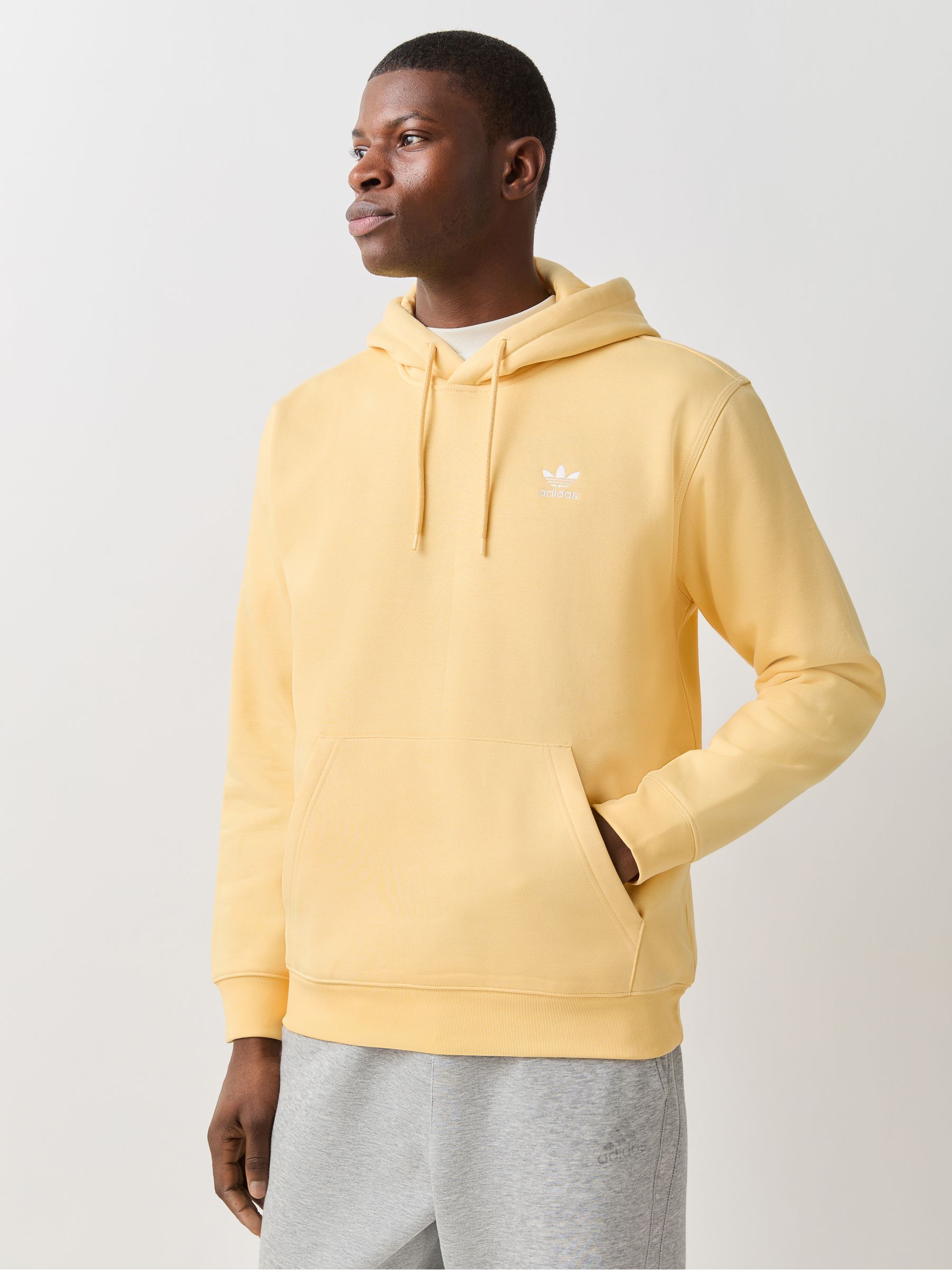 Buy adidas Originals Yellow Trefoil Essentials Loose Hoodie from
