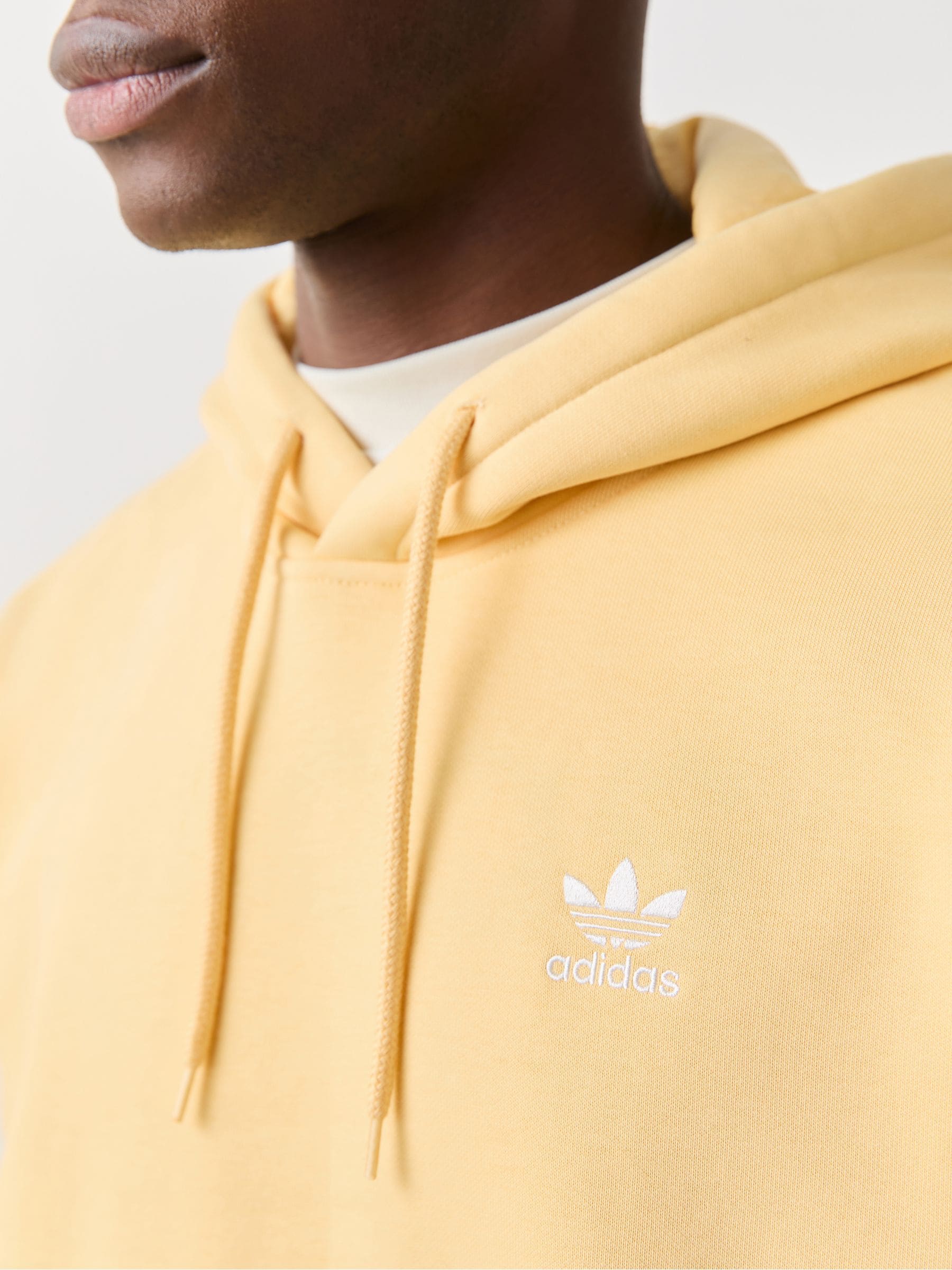 Buy adidas Originals Yellow Trefoil Essentials Loose Hoodie from