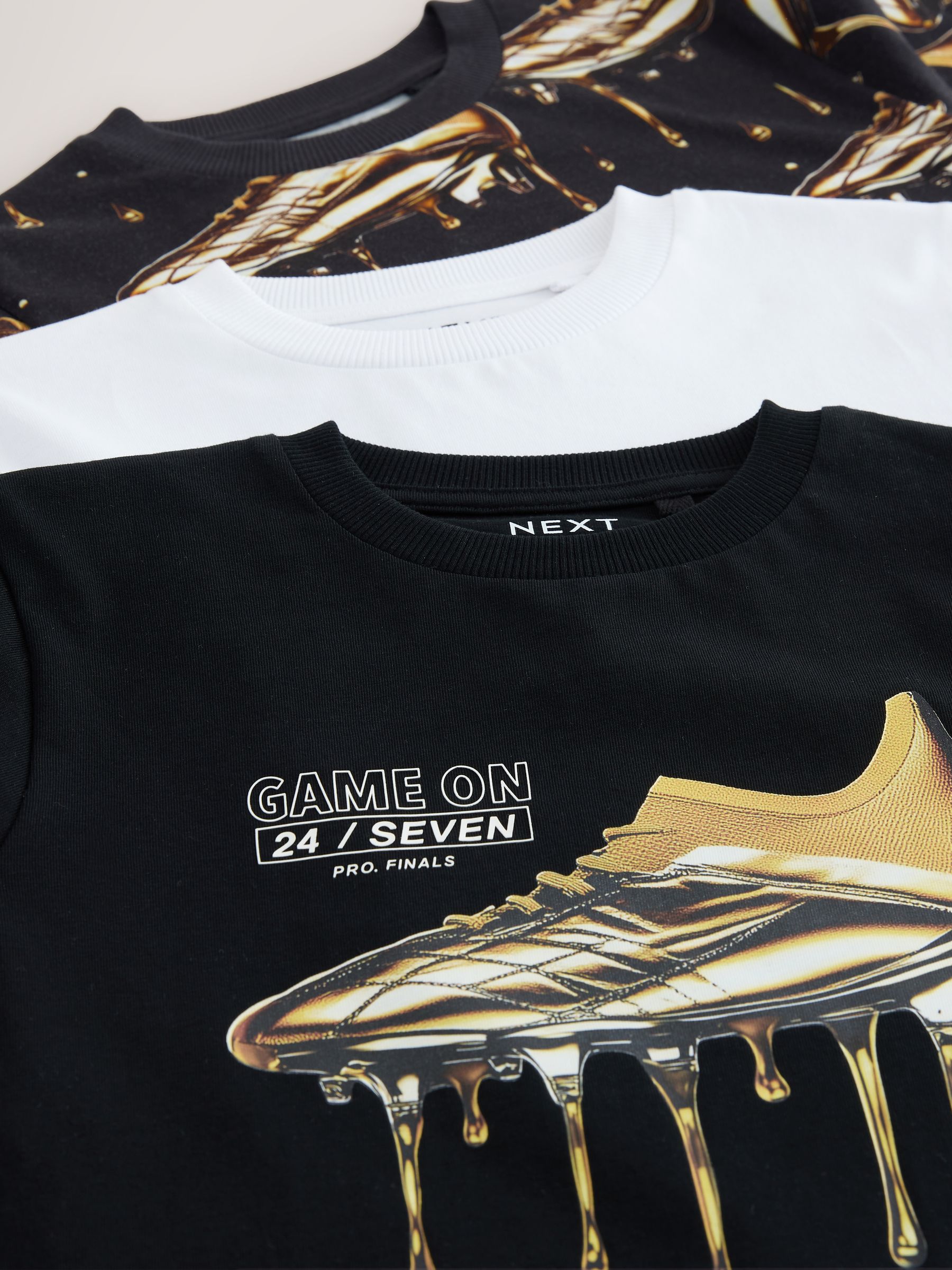 Buy Black/Gold/White Regular Fit Graphic Print Short Sleeve T