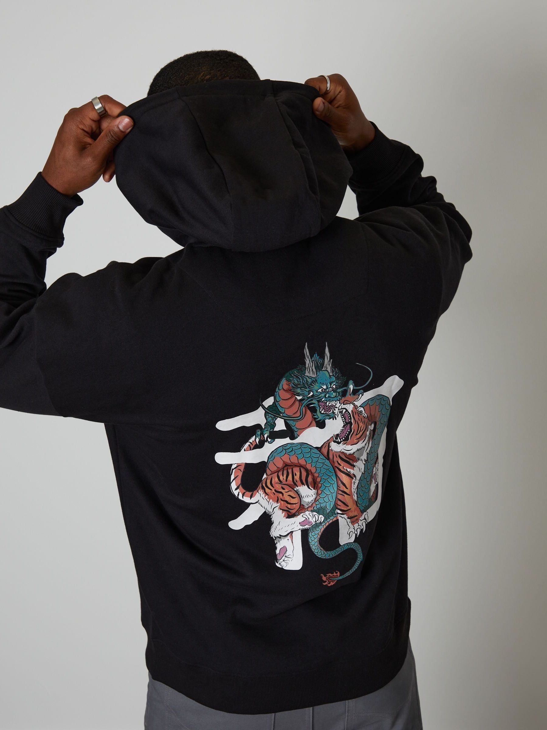 Buy Threadbare Black Relaxed Fit Graphic Print Hoodie from the