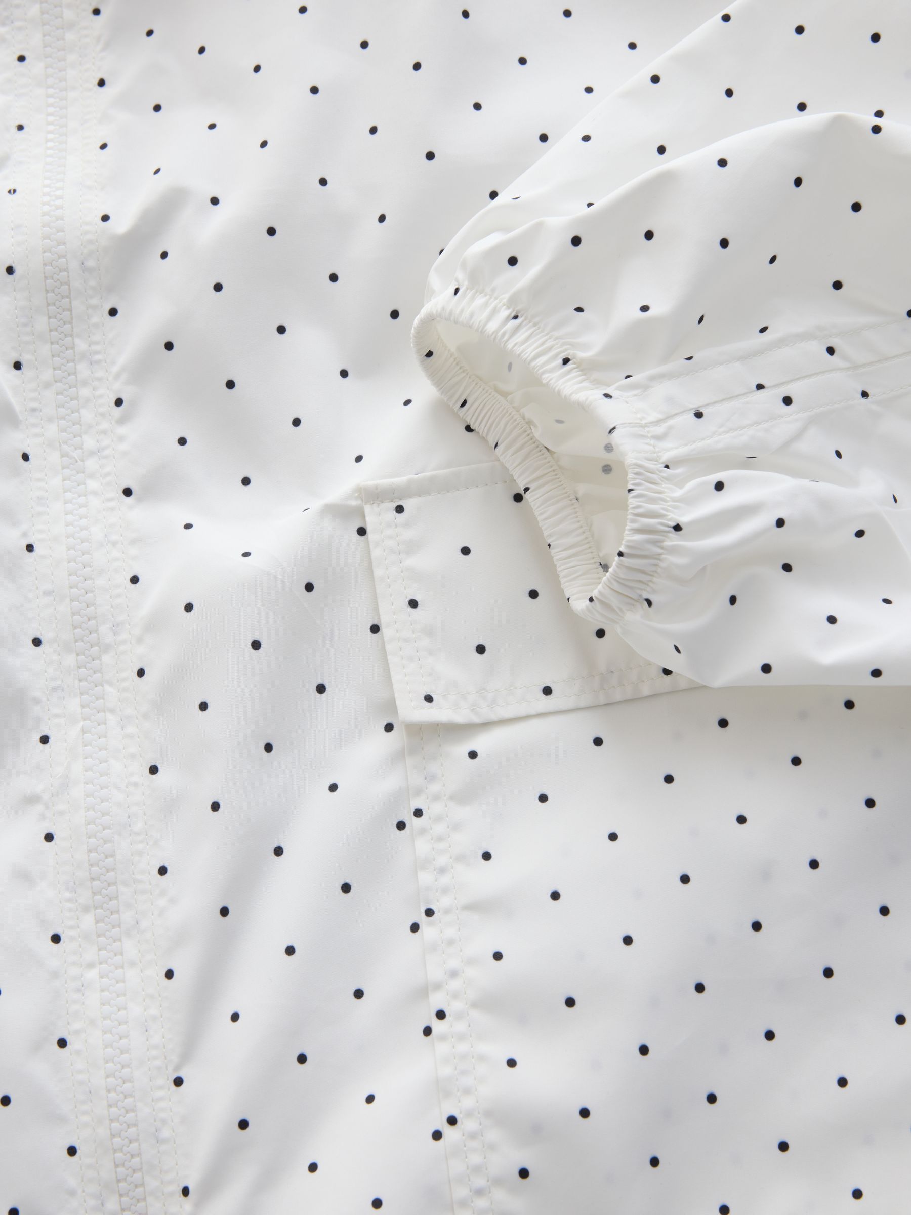 Buy White/Black Polka Dot Shower Resistant Rain Jacket from the