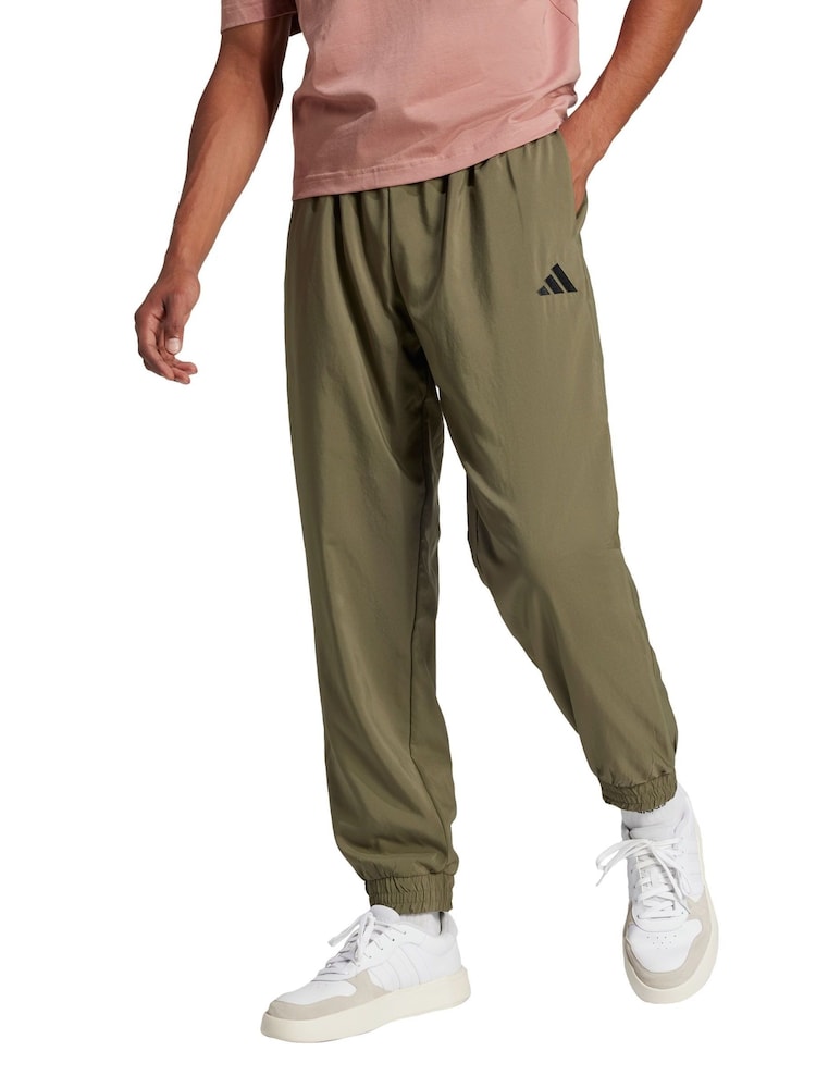adidas Green Essentials Small Logo Stanford Tracksuit Bottoms - Image 1 of 5 adidas Green Essentials Small Logo Stanford Tracksuit Bottoms - Image 1 of 5