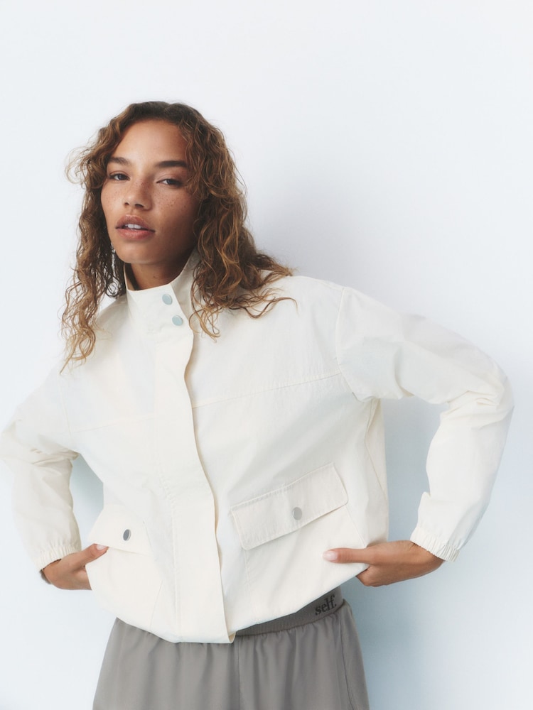 self. Ecru High Neck Nylon Running Jacket - Image 1 of 5