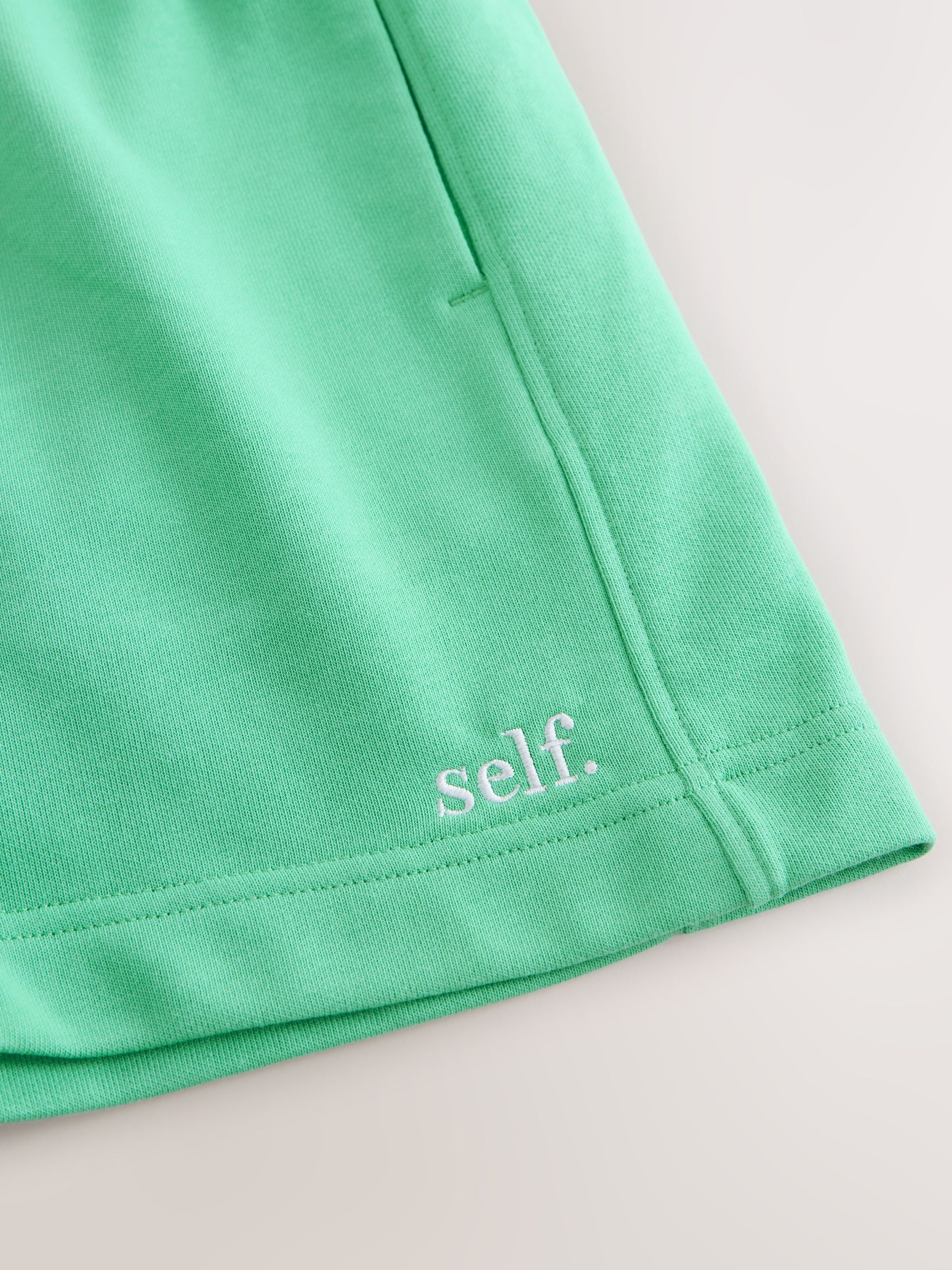 Buy self. Green Shorts from the Next UK online shop