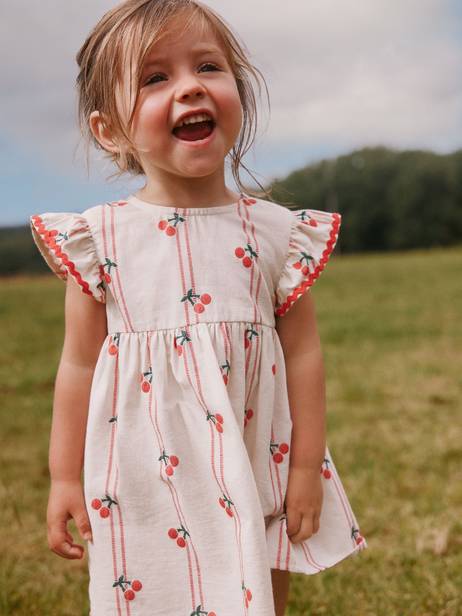 Buy Red/Ecru Cherry Ric Rac Frill Sleeve Dress (3mths-8yrs) from