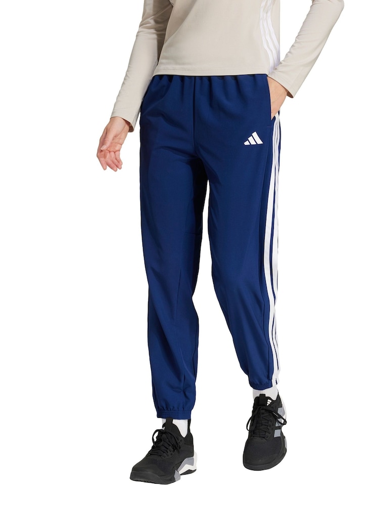 adidas Blue Train Essentials 3 Stripes Woven Joggers - Image 1 of 5 adidas Blue Train Essentials 3 Stripes Woven Joggers - Image 1 of 5