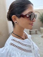 Never Fully Dressed Red Wiggle Arm Acetate Sunglasses with Case - Image 1 of 4