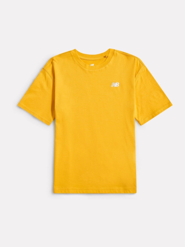 New Balance Gold Jersey Small Logo Cotton T-Shirt - Image 1 of 3 New Balance Gold Jersey Small Logo Cotton T-Shirt - Image 1 of 3