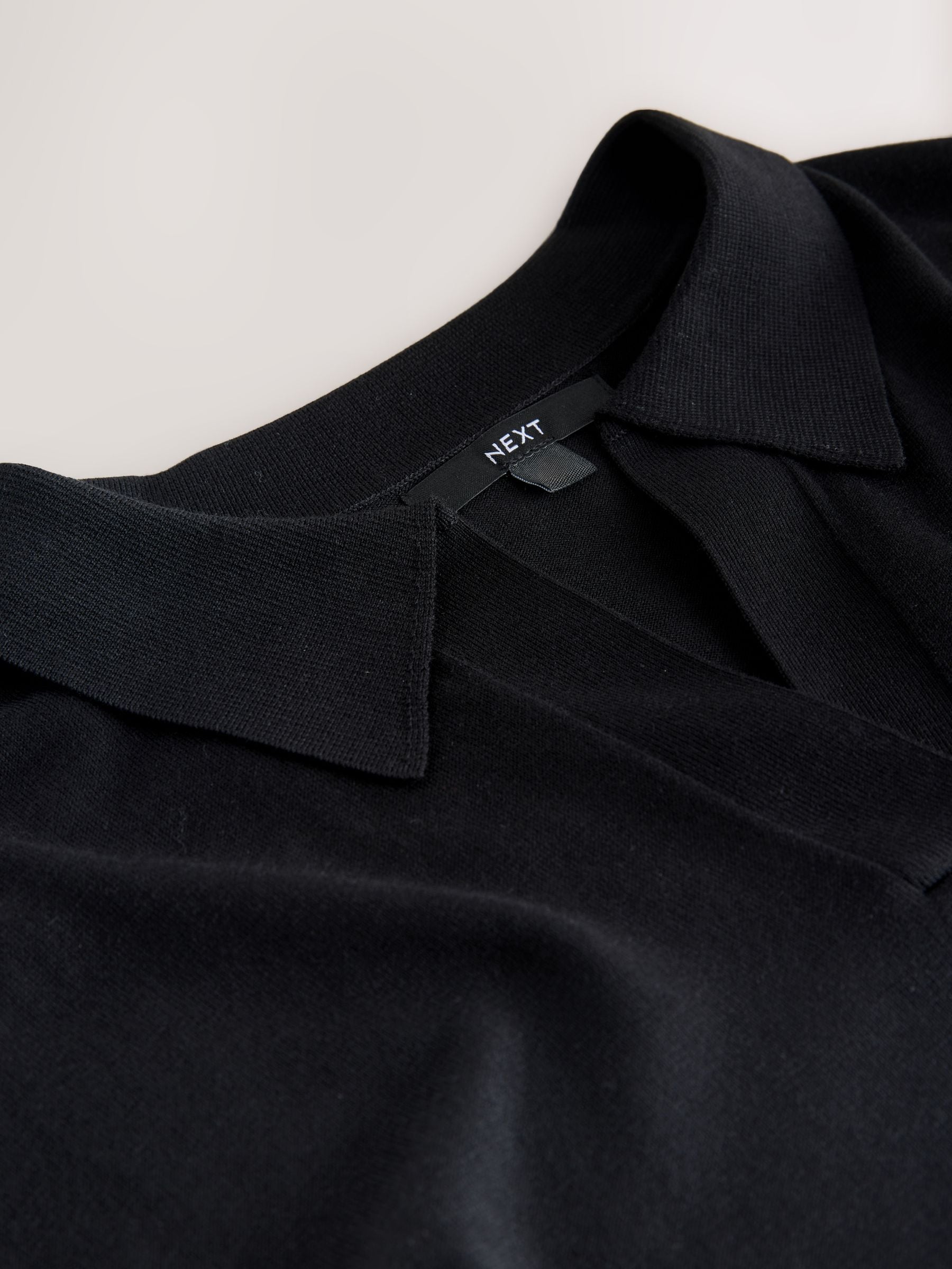 Buy Black Cotton Rich Soft Touch Knitted Polo Top from the Next UK