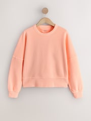 برتقالي فلوري - سويت شيرت بمظهر باهت بياقة بحافة مستديرة - صورة 1 من 3