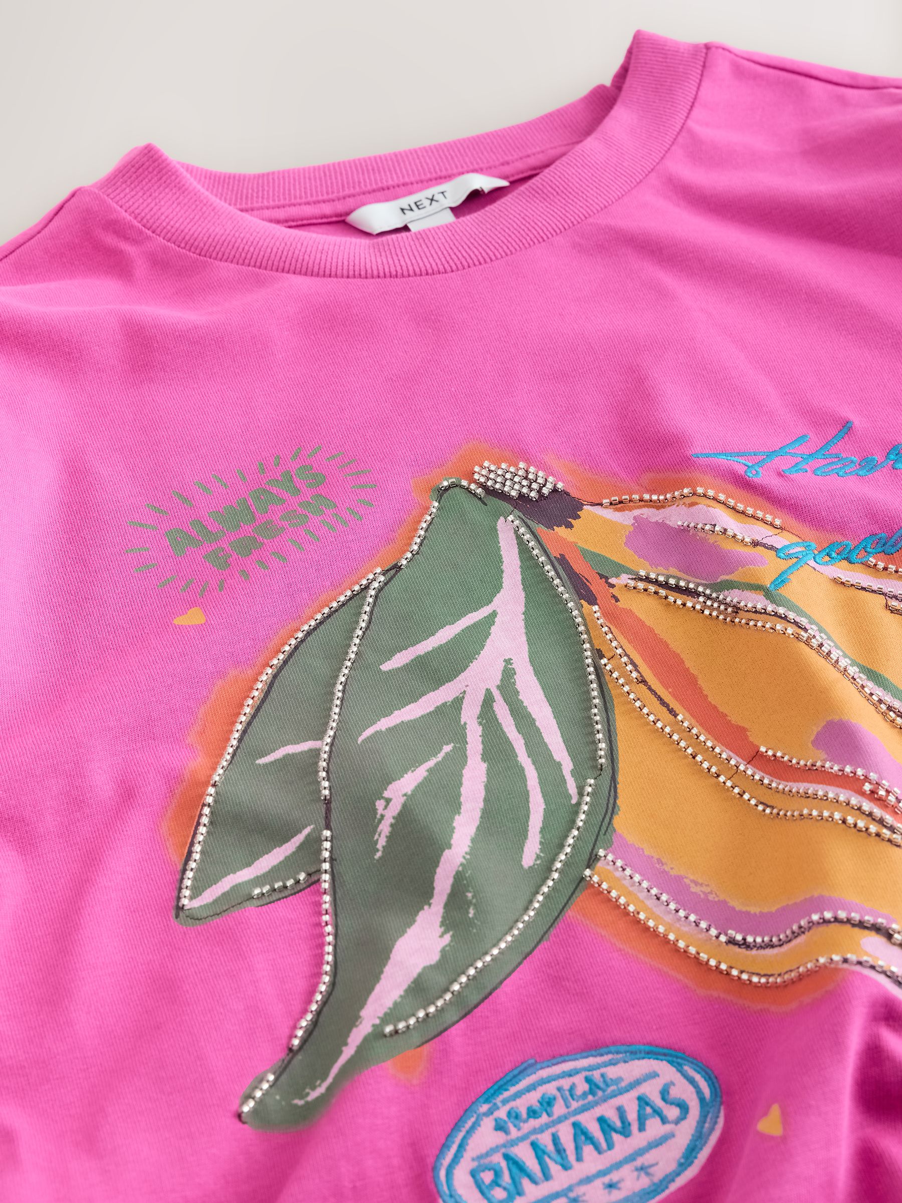 Buy Pink Beaded Banana Graphic Short Sleeve Crew Neck T-Shirt from