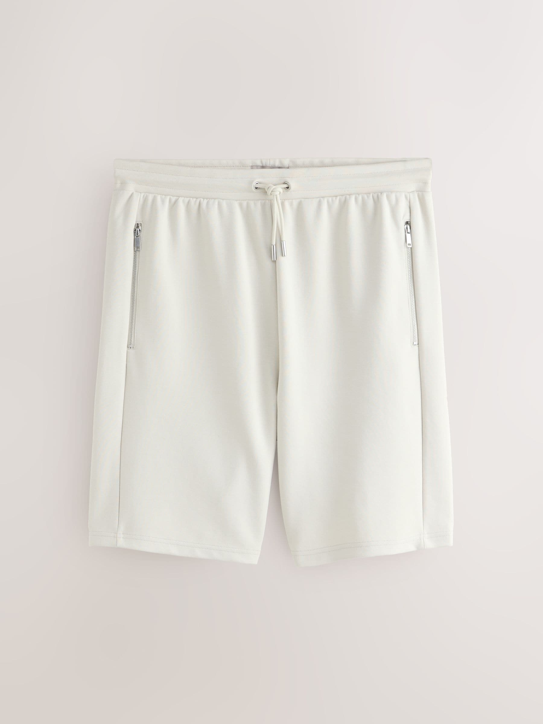 Buy Stone Straight Fit Zip Pocket Jersey Shorts from the Next UK
