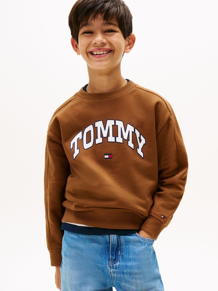 Tommy Hilfiger Brown Varsity Logo Print Crew Neck Sweatshirt - Image 1 of 5 Tommy Hilfiger Brown Varsity Logo Print Crew Neck Sweatshirt - Image 1 of 5