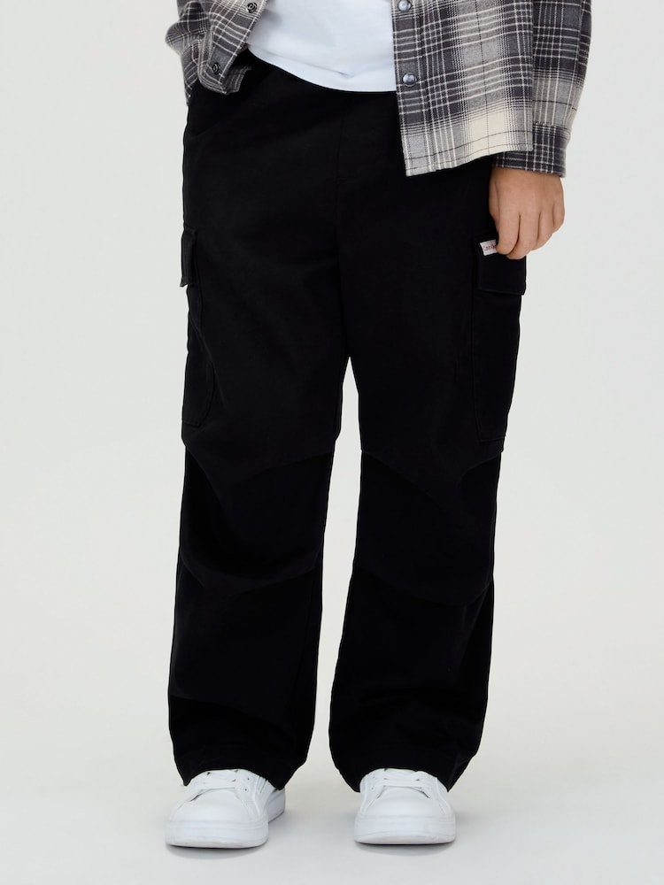 Calvin Klein Black Baggy Sateen Cargo Trousers - Image 1 of 5 Calvin Klein Black Baggy Sateen Cargo Trousers - Image 1 of 5