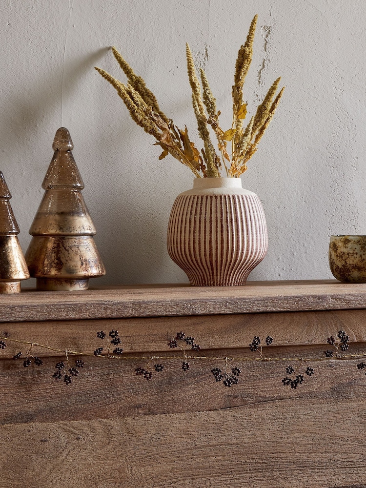 Nkuku Brass and Ruby Tanu Mango Wood Beaded Christmas Garland - Image 1 of 3 Nkuku Brass and Ruby Tanu Mango Wood Beaded Christmas Garland - Image 1 of 3