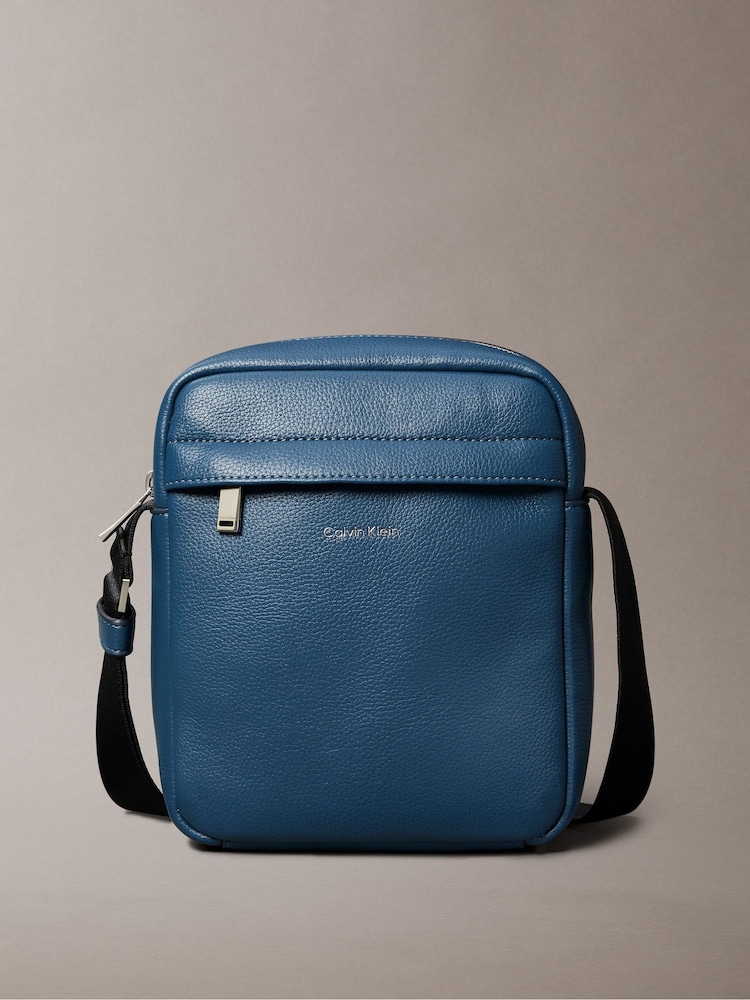 Calvin Klein Blue Micro Pebble Reporter Bag - Image 1 of 5 Calvin Klein Blue Micro Pebble Reporter Bag - Image 1 of 5
