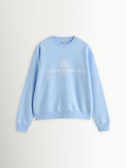 Sporty & Rich Blue Heavyweight Crest Crew Neck Sweat Top - Image 1 of 4