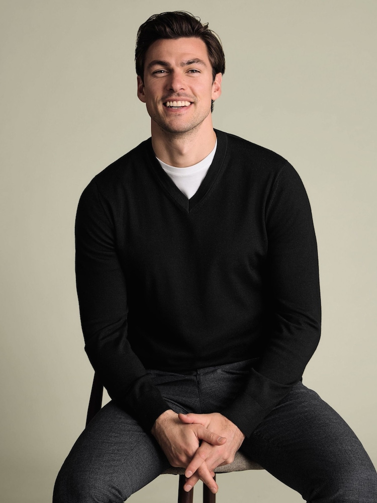 Charles Tyrwhitt Black Pure Merino V-Neck Jumper - Image 1 of 6 Charles Tyrwhitt Black Pure Merino V-Neck Jumper - Image 1 of 6