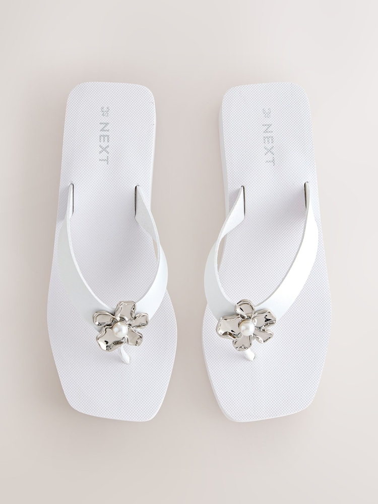 White Hardware Trim Wedge Flip Flops - Image 1 of 10