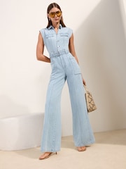 Friends Like These Blue Petite Sleeveless Belted Denim Utility Jumpsuit - Image 1 of 4