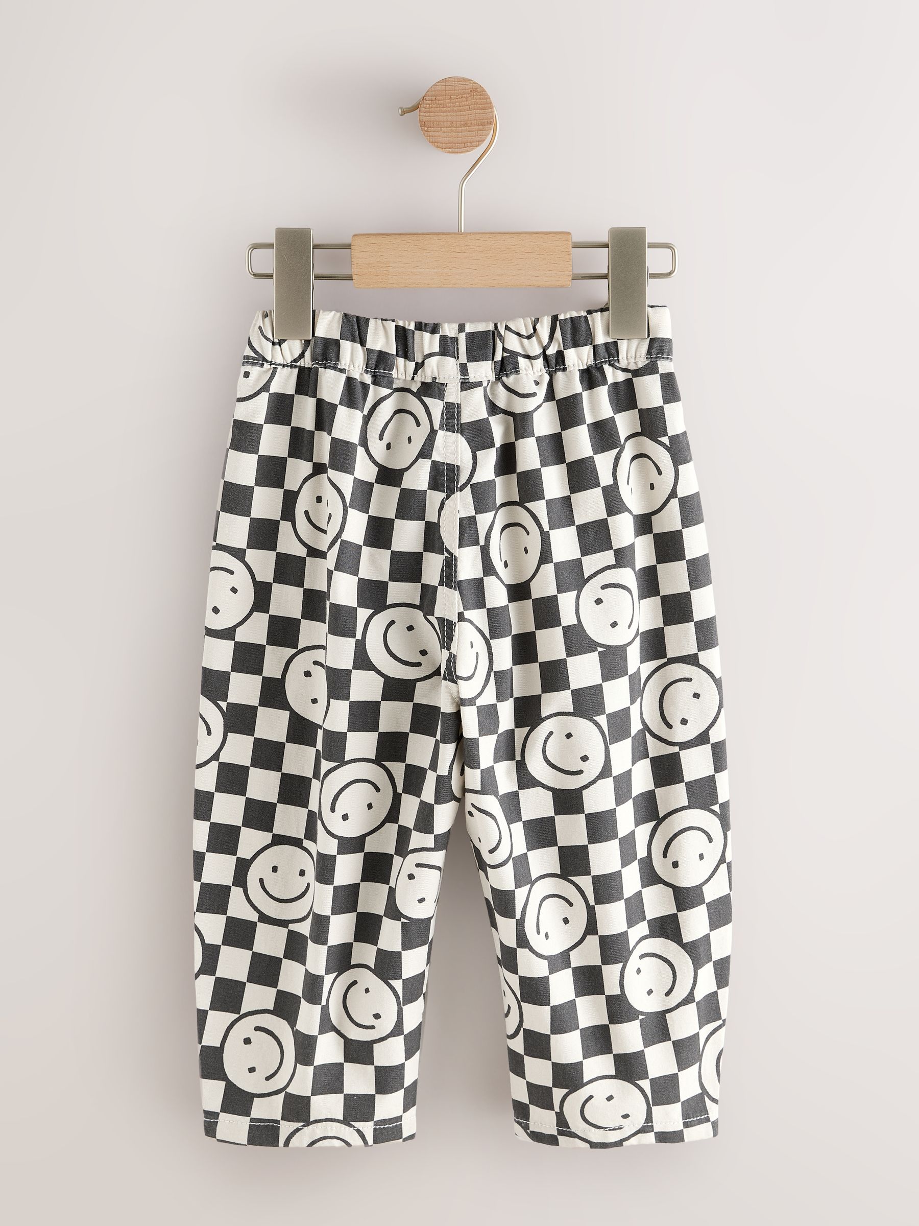 Buy Black/Neutral Happy Face Checkerboard Barrel Pull On Trousers