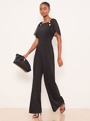 Lipsy Black Petite Chiffon Flutter Sleeve Miltary Button Jumpsuit - Image 1 of 4