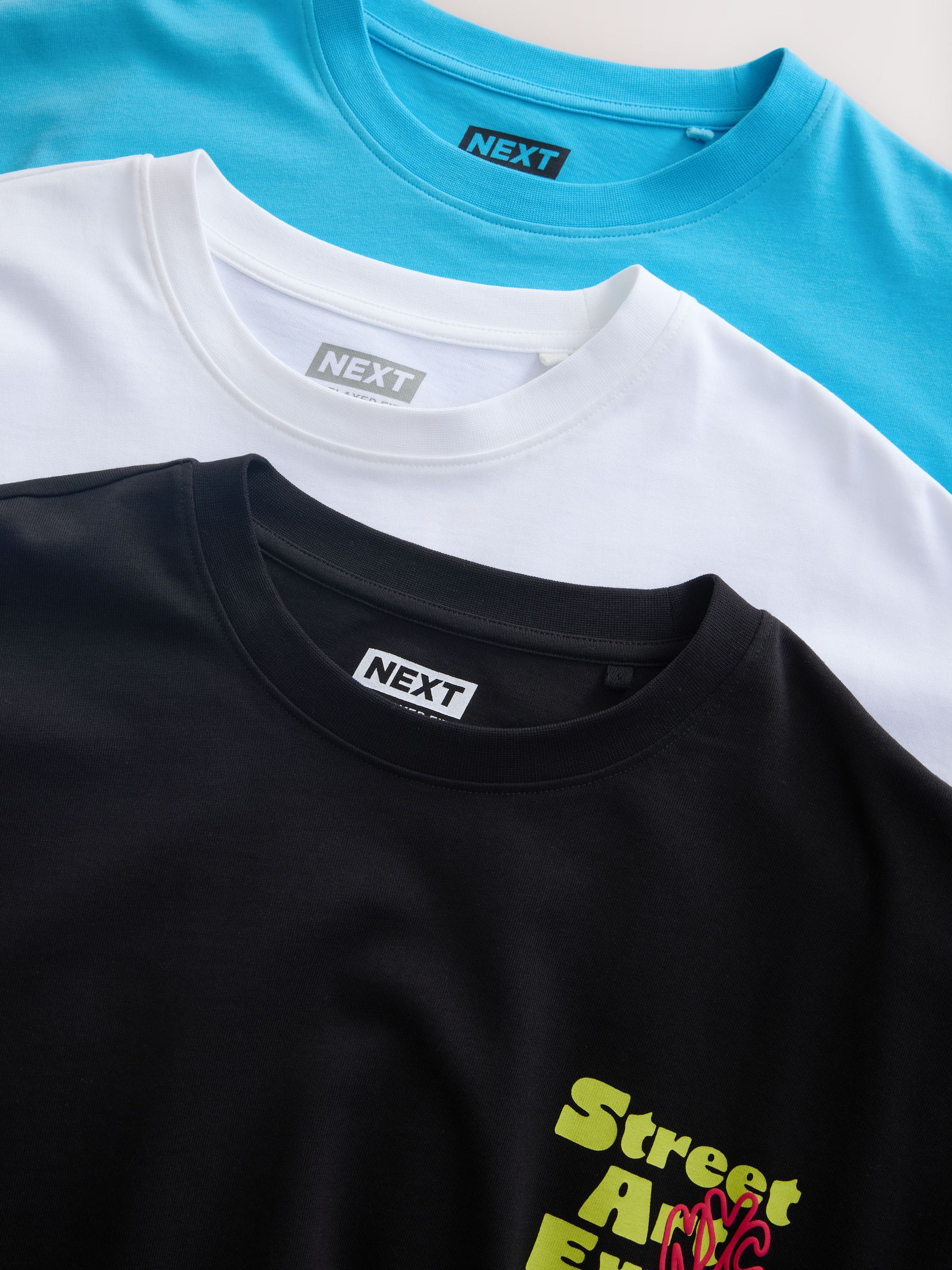 Buy White/Black/Blue Relaxed Fit Graphic Print T-Shirts 3 Pack