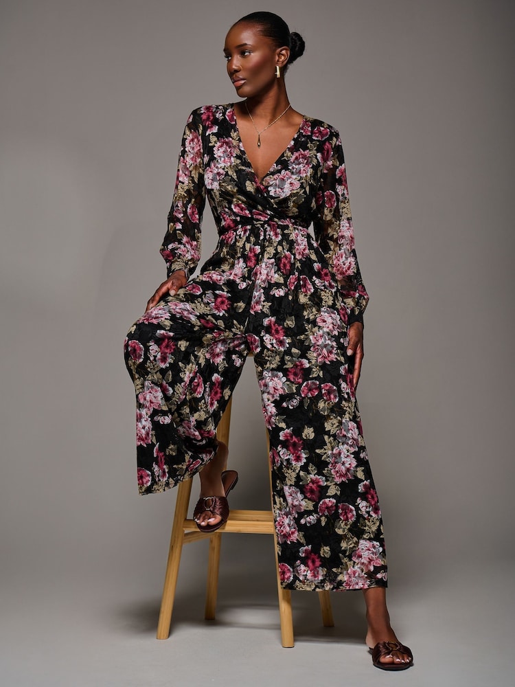 Jolie Moi Chrome Black Lace Wrap Tie Waist Long Sleeve Jumpsuit - Image 1 of 6 Jolie Moi Chrome Black Lace Wrap Tie Waist Long Sleeve Jumpsuit - Image 1 of 6