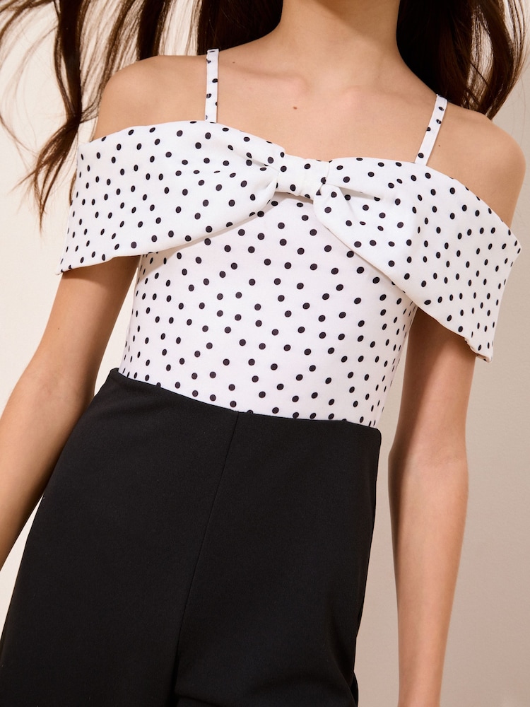 Lipsy Black/White Polka Dot Bow Bardot Jumpsuit (7-16yrs) - Image 2 of 5 Lipsy Black/White Polka Dot Bow Bardot Jumpsuit (7-16yrs) - Image 2 of 5