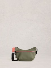 أخضر - حقيبة تعلق حول الجسم بملمس مطاطي Alex من White Stuff - Image 1 of 4