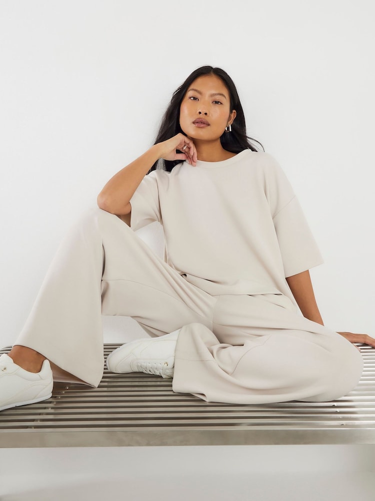 River Island Cream Petite Premium Wide Leg Joggers - Image 1 of 4