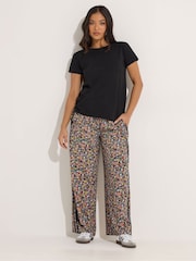 PixieGirl Petite Black Ditsy Wide Leg Side Stripe Trousers - Image 1 of 5