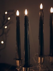 Lights4fun Set of 4 TruGlow Black Dripping Wax LED Taper Candles With Remote Control - Image 1 of 3