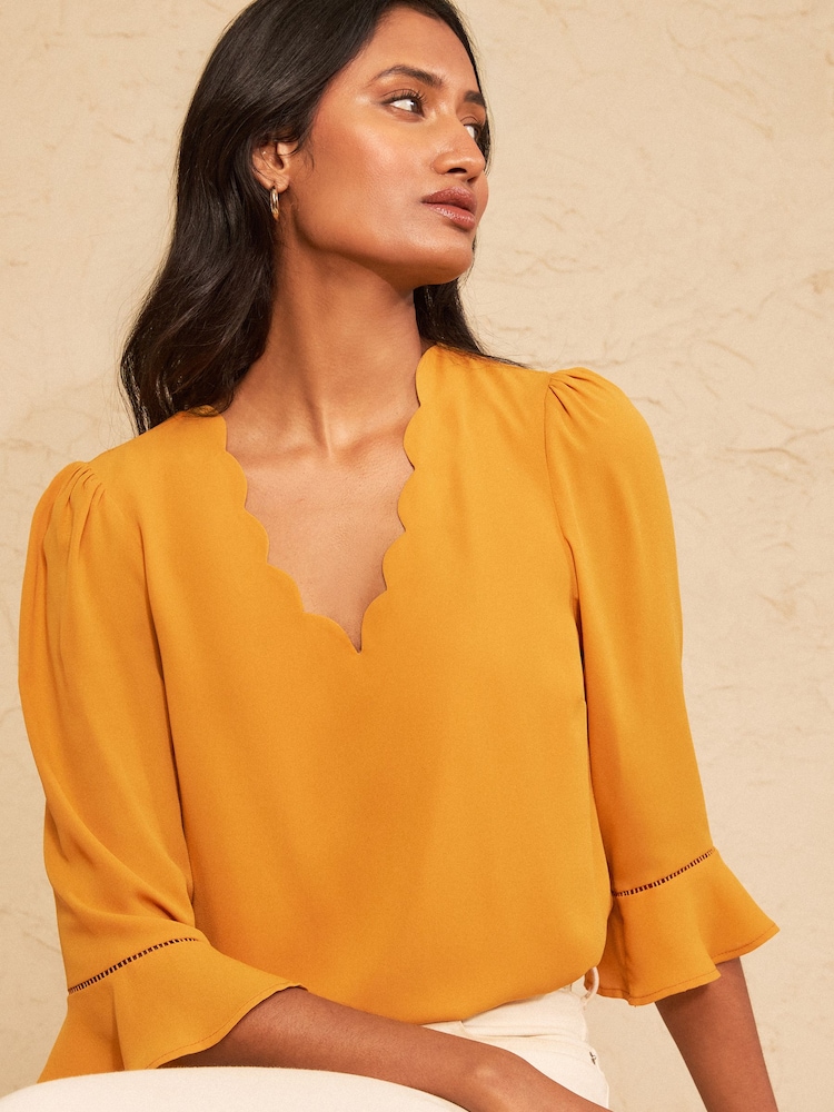 Love & Roses Ochre Yellow Scallop V-Neck Flute Sleeve Blouse - Image 1 of 4 Love & Roses Ochre Yellow Scallop V-Neck Flute Sleeve Blouse - Image 1 of 4