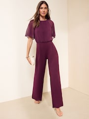 Friends Like These Aubergine Purple Petite Chiffon Flutter Sleeve Jumpsuit - Image 4 of 5