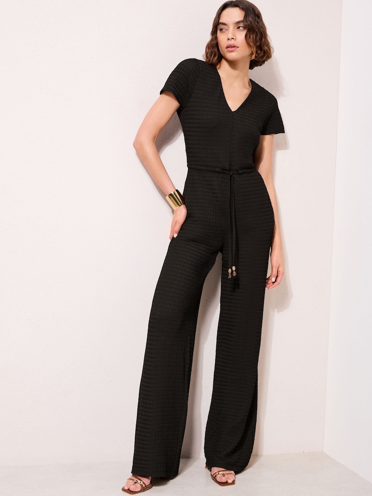 Friends Like These Black Petite Short Sleeve Jersey Textured Jumpsuit - Image 2 of 4 Friends Like These Black Petite Short Sleeve Jersey Textured Jumpsuit - Image 2 of 4