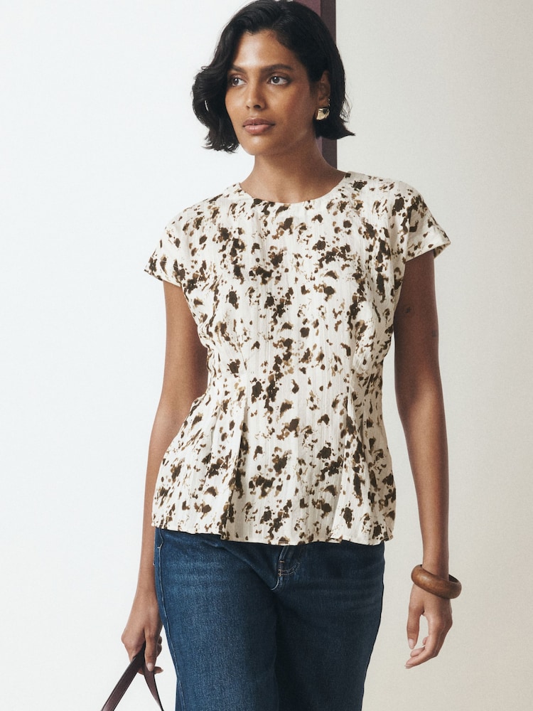 Ecru Speckle Print Soft Peplum Short Sleeve Top - Image 1 of 9 Ecru Speckle Print Soft Peplum Short Sleeve Top - Image 1 of 9