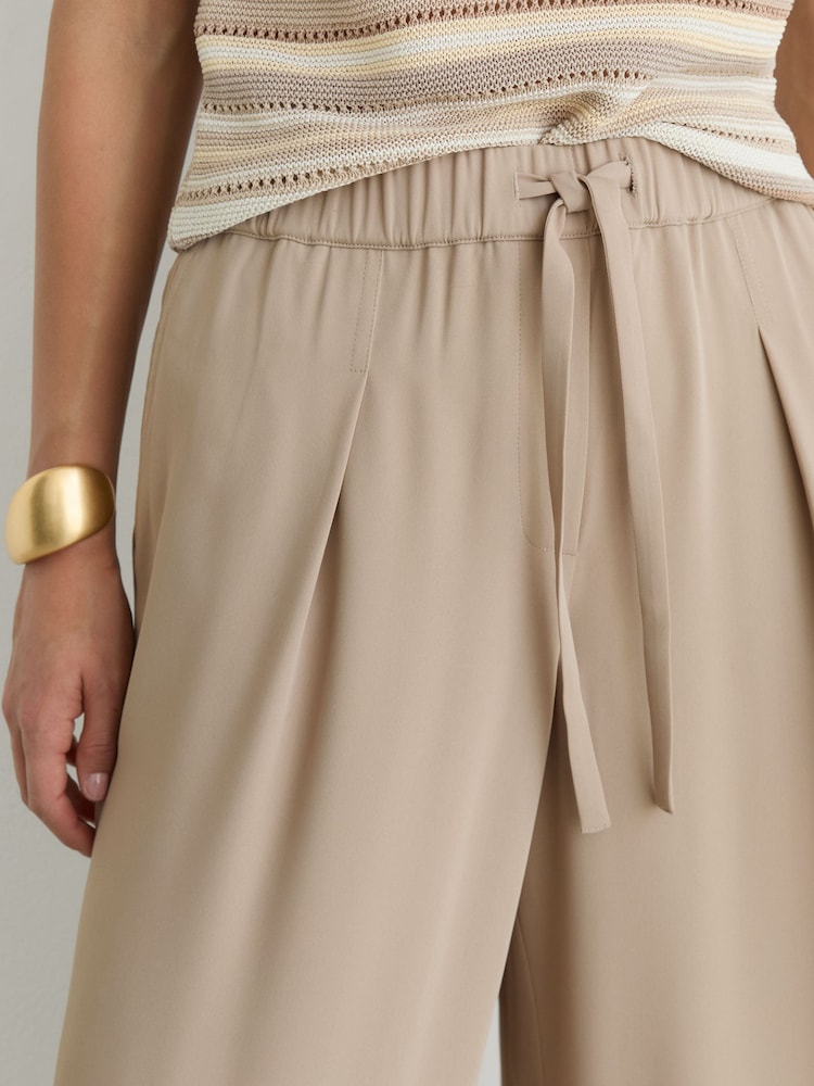 Reiss Neutral Aimee Petite Drawstring Wide-Leg Trousers - Image 1 of 8 Reiss Neutral Aimee Petite Drawstring Wide-Leg Trousers - Image 1 of 8