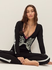 Victoria's Secret Pink Black Skeleton Halloween Onesie - Image 1 of 4