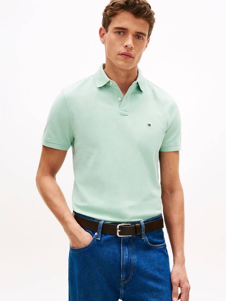 Tommy Hilfiger Green 1985 Regular Fit Pique Polo Shirt - Image 1 of 5 Tommy Hilfiger Green 1985 Regular Fit Pique Polo Shirt - Image 1 of 5