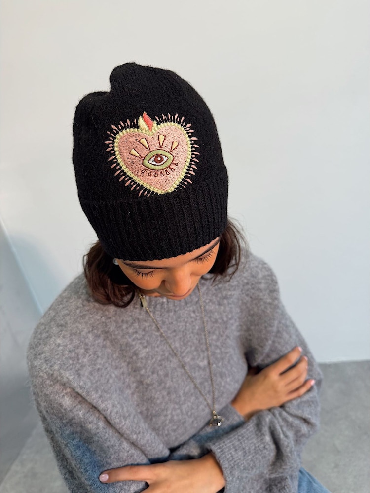 Never Fully Dressed Black Heart Knitted Beanie - Image 1 of 4 Never Fully Dressed Black Heart Knitted Beanie - Image 1 of 4