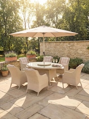Bramblecrest Sandstone Woodchester Elliptical Table with 6 Dining Armchairs and Parasol - Image 1 of 6