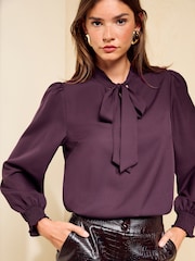 Friends Like These Burgundy Long Sleeve Tie Neck Blouse With Shirred Cuffs - Image 1 of 5