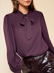 Friends Like These Burgundy Long Sleeve Tie Neck Blouse With Shirred Cuffs - Image 2 of 5
