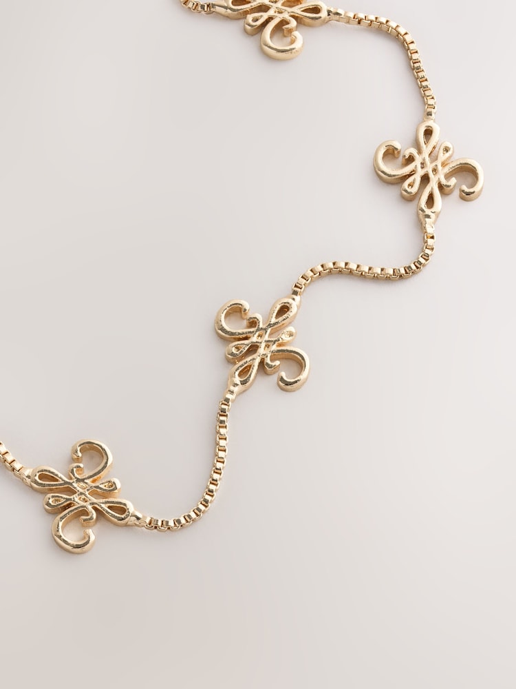 لون ذهبي - سوار Pully بتصميم Monogram - صورة 2 من 3 لون ذهبي - سوار Pully بتصميم Monogram - صورة 2 من 3